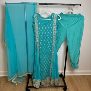 Elegant Teal Traditional Outfit with Gold Accents